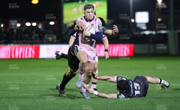 010126 - Ospreys v Cardiff Rugby, United Rugby Championship - Callum Sheedy of Cardiff Rugby is tackled short of the line by Rhys Davies of Ospreys