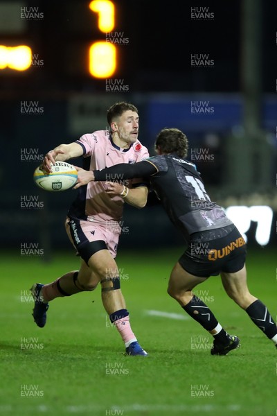 010126 - Ospreys v Cardiff Rugby - United Rugby Championship - Harri Millard of Cardiff Rugby is tackled by Keelan Giles of Ospreys 