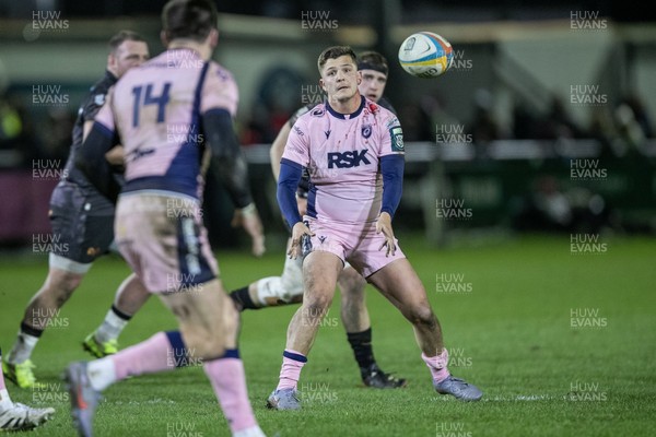 010126 - Ospreys v Cardiff Rugby - United Rugby Championship - Callum Sheedy offloads to Josh Adams of Cardiff Rugby