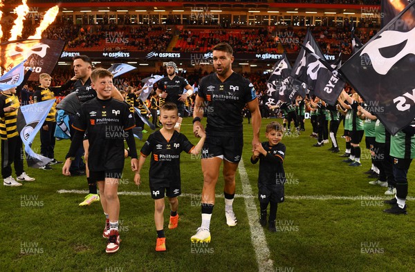 220423 - Ospreys v Cardiff - United Rugby Championship - Rhys Webb of Ospreys leads out his side with his sons on his 200th Ospreys game