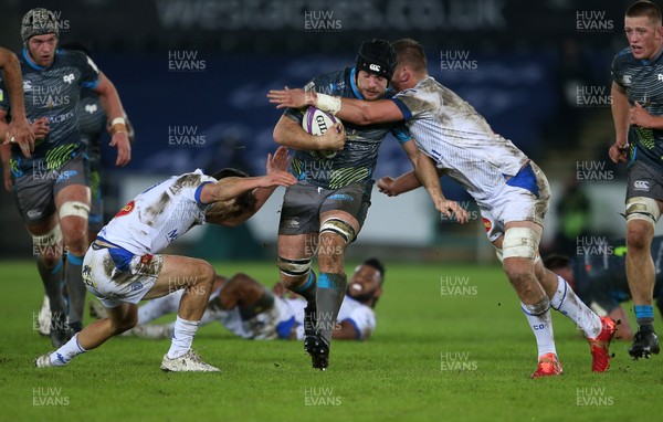 121220 - Ospreys v Castres Olympique - European Challenge Cup - Morgan Morris of Ospreys is tackled by Thomas Fortunel and Kevin Kornath of Castres