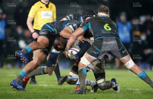 121220 - Ospreys v Castres Olympique - European Challenge Cup - Hans Nkinsi of Castres is tackled by Nicky Smith and Will Griffiths of Ospreys