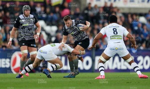 151017 - Ospreys v Clermont Auvergne - European Rugby Champions Cup - Dan Biggar of Ospreys is tackled by Paul Jedrasiak of Clermont