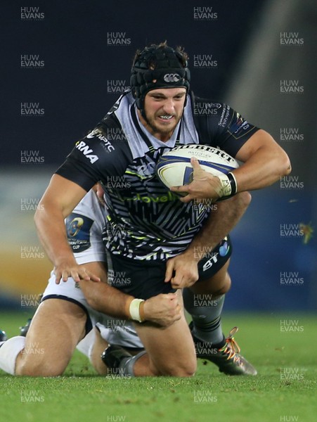 151017 - Ospreys v Clermont Auvergne - European Rugby Champions Cup - Dan Evans of Ospreys is tackled by Morgan Parra of Clermont