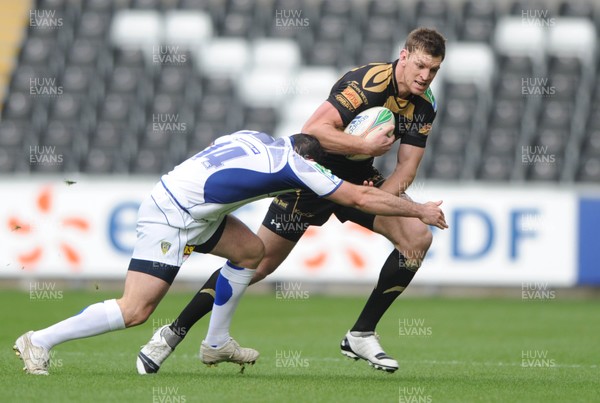 18.10.09 - Ospreys v ASM Clermont Auvergne - Heineken Cup - Nikki Walker of Ospreys is tackled by Benoit Baby of Clermont Auvergne. 