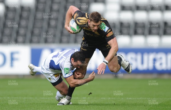 18.10.09 - Ospreys v ASM Clermont Auvergne - Heineken Cup - Nikki Walker of Ospreys is tackled by Benoit Baby of Clermont Auvergne. 