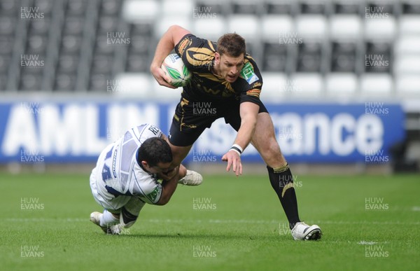 18.10.09 - Ospreys v ASM Clermont Auvergne - Heineken Cup - Nikki Walker of Ospreys is tackled by Benoit Baby of Clermont Auvergne. 