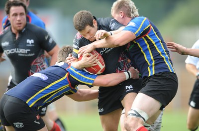 30.08.08 - Ospreys v Clubs Select XV - Ospreys Jonny Vaughton is held by the Clubs defence. 