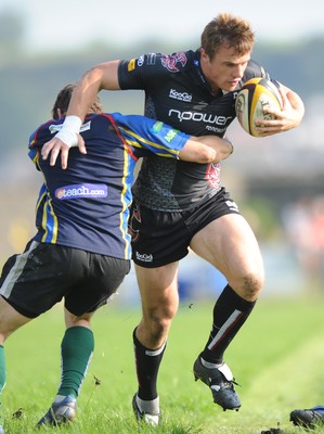 30.08.08 - Ospreys v Clubs Select XV - Ospreys Tommy Bowe is held by the Clubs defence. 