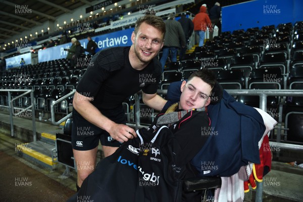 060418 - Ospreys v Connacht - Guinness PRO14 - Dan Biggar of Ospreys gives his jersey to a fan at the end of his last home game