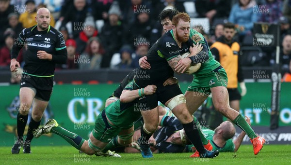 070117 - Ospreys v Connacht - Guinness PRO12 - Dan Baker of Ospreys is tackled by Sean O'Brien and Danie Poolman of Connacht by Chris Fairweather/Huw Evans Agency