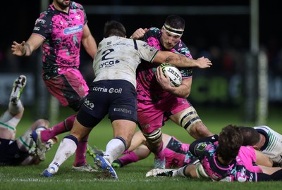 071225 - Ospreys v Connacht - European Challenge Cup - Ryan Smith of Ospreys is tackled by Dave Heffernan of Connacht 