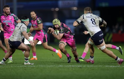 071225 - Ospreys v Connacht - European Challenge Cup - Harri Deaves of Ospreys is challenged by Sean Jansen of Connacht 