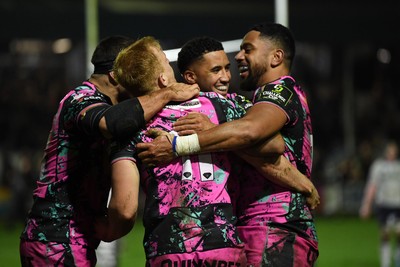 071225 - Ospreys v Connacht - EPCR Challenge Cup - Iestyn Hopkins of Ospreys celebrates scoring a try with team mates