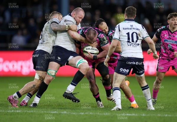 071225 - Ospreys v Connacht - European Challenge Cup - Sam Parry of Ospreys is tackled by Joe Joyce of Connacht 