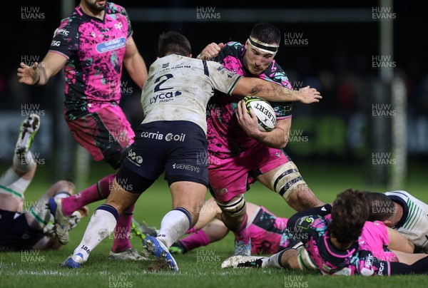 071225 - Ospreys v Connacht - European Challenge Cup - Ryan Smith of Ospreys is tackled by Dave Heffernan of Connacht 