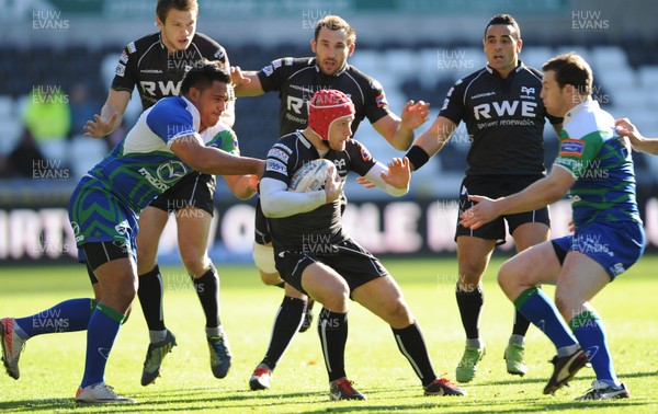 271012 - Ospreys v Connacht - RaboDirect PRO12 -Richard Fussell of Ospreys is tackled by Mata Fifita and Willie Faloon of Connacht