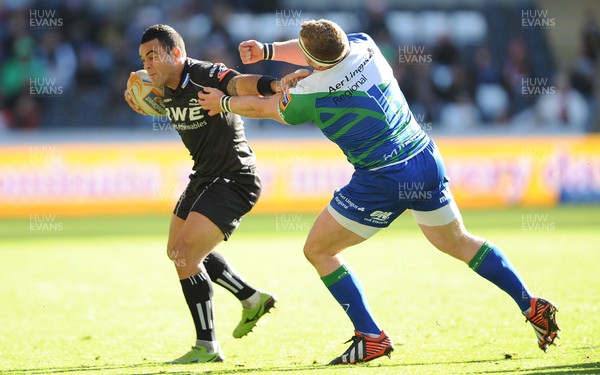 271012 - Ospreys v Connacht - RaboDirect PRO12 -Kahn Fotuali'i of Ospreys holds off Brett Wilkinson of Connacht