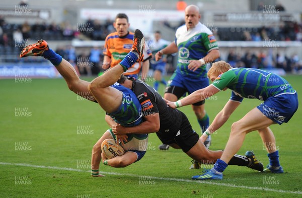 271012 - Ospreys v Connacht - RaboDirect PRO12 -Tiernan O'Halloran of Connacht is tackled by Ashley Beck of Ospreys