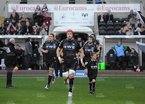 271012 - Ospreys v Connacht - RaboDirect PRO12 -Alun Wyn Jones of Ospreys runs out with the mascot