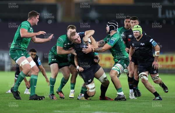 291022 - Ospreys v Connacht - BKT United Rugby Championship - Huw Sutton of Ospreys is tackled by David Hawkshaw and Conor Oliver of Connacht