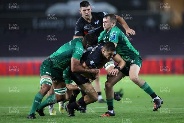 291022 - Ospreys v Connacht - BKT United Rugby Championship - Max Nagy of Ospreys is tackled by Jarrad Butler and John Porch of Connacht