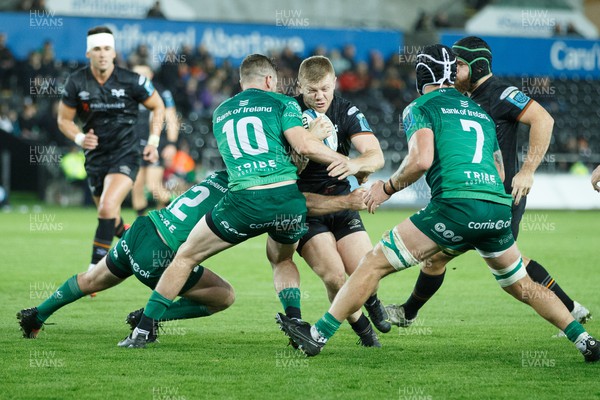 291022 - Ospreys v Connacht - United Rugby Championship - Kieran Williams of Ospreys is tackled by Jack Carty of Connacht