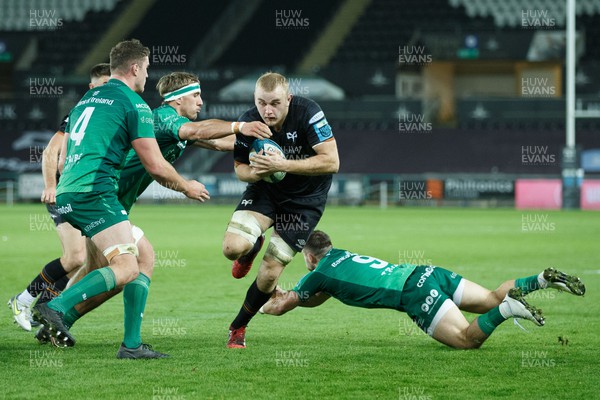 291022 - Ospreys v Connacht - United Rugby Championship - Huw Sutton of Ospreys evades the tackle of Caolin Blade of Connacht