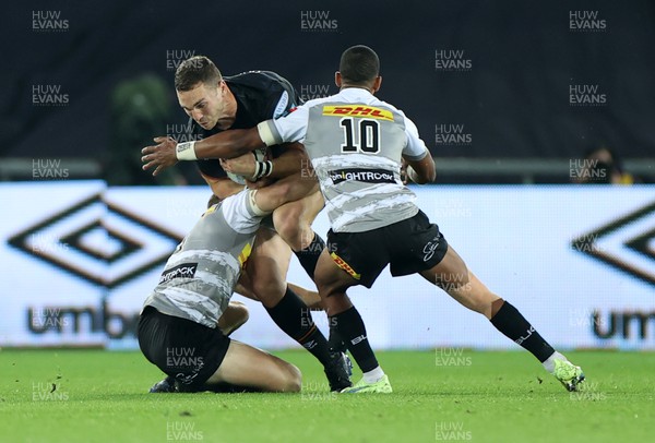 141022 - Ospreys v DHL Stormers - BKT United Rugby Championship - George North of Ospreys is tackled by Paul de Wet and Manie Libbok of Stormers