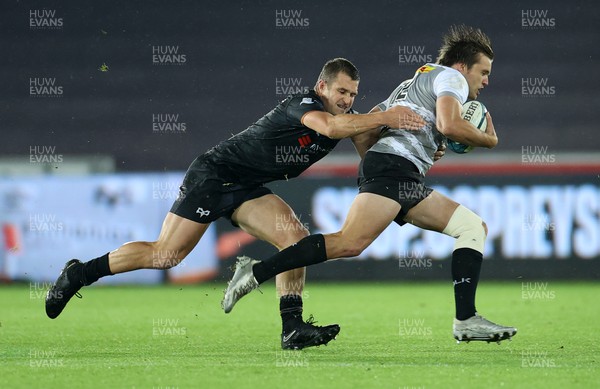 141022 - Ospreys v DHL Stormers - BKT United Rugby Championship - Dan du Plessis of Stormers is tackled by Michael Collins of Ospreys