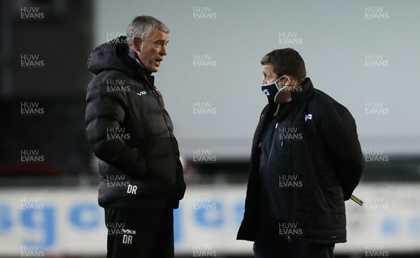 060321 Ospreys v Dragons, Guinness PRO14 - Dragons head coach Dean Ryan, left, chats with Ospreys head coach Toby Booth ahead of the match between Ospreys and Dragons