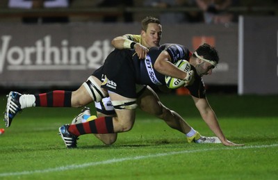 141114 -  Ospreys v Newport Gwent Dragons, LV= Cup, Brewery Field, Bridgend - Dragons' Cory Hill powers past Ospreys' Hanno Dirksen to score try