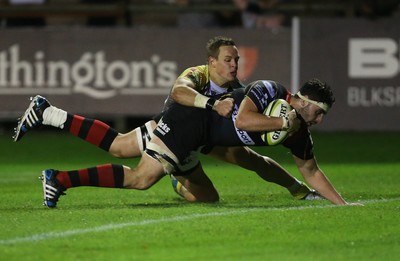 141114 -  Ospreys v Newport Gwent Dragons, LV= Cup, Brewery Field, Bridgend - Dragons' Cory Hill powers past Ospreys' Hanno Dirksen to score try