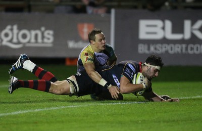 141114 -  Ospreys v Newport Gwent Dragons, LV= Cup, Brewery Field, Bridgend - Dragons' Cory Hill powers past Ospreys' Hanno Dirksen to score try