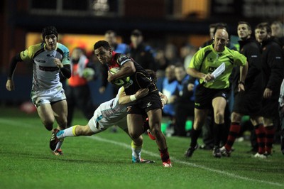 141114 -  Ospreys v Newport Gwent Dragons, LV= Cup, Brewery Field, Bridgend - Ashton Hewitt is tackled