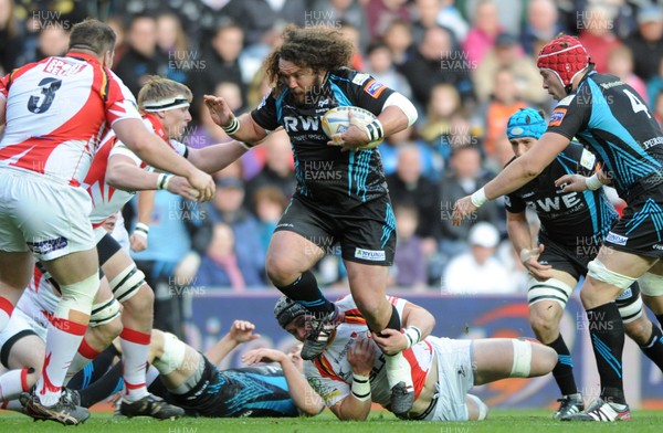 200412 - Ospreys v Newport-Gwent Dragons - RaboDirect PRO12 -Adam Jones of Ospreys is tackled by Dan Lydiate of Dragons