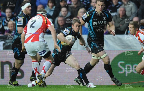 200412 - Ospreys v Newport-Gwent Dragons - RaboDirect PRO12 -Shane Williams of Ospreys takes on Steve Jones of Dragons