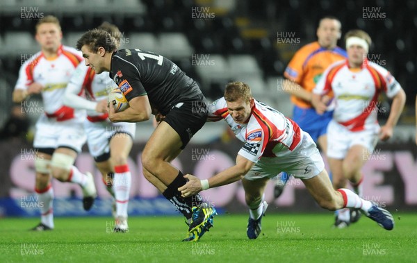 220313 -  Ospreys v Newport-Gwent Dragons - RaboDirect PRO12 -Ashley Beck of Ospreys is tackled by Jack Dixon of Newport-Gwent Dragons 