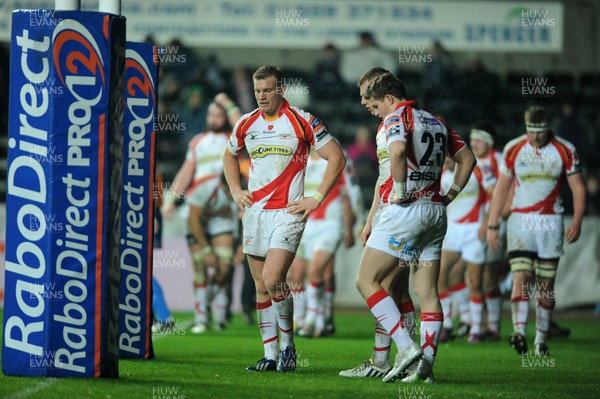 220313 -  Ospreys v Newport-Gwent Dragons - RaboDirect PRO12 -Dragons players look dejected 