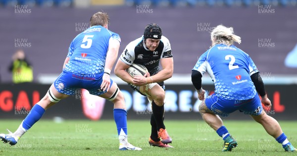 230319 - Ospreys v Dragons - Guinness PRO14 - James King of Ospreys is tackled by Matthew Screech and Richard Hibbard of Dragons