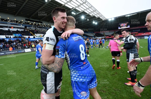 230319 - Ospreys v Dragons - Guinness PRO14 - Adam Beard of Ospreys and Ross Moriarty of Dragons at the end of the game