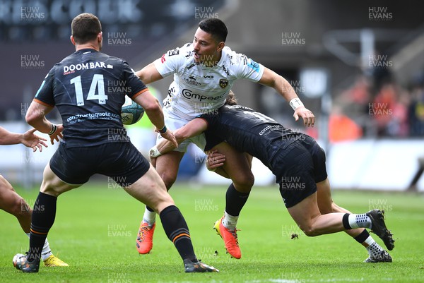 250323 - Ospreys v Dragons - United Rugby Championship - Sio Tomkinson of Dragons is tackled by Jack Walsh of Ospreys