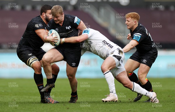 250323 - Ospreys v Dragons - United Rugby Championship - Keiran Williams of Ospreys is tackled by Steff Hughes of Dragons 