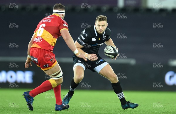 271017 - Ospreys v Dragons Rugby - Guinness PRO14 - Dan Biggar of Ospreys is tackled by James Thomas of Dragons