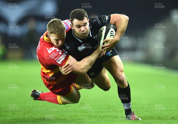 271017 - Ospreys v Dragons Rugby - Guinness PRO14 - Tom Habberfield of Ospreys is tackled by Jack Dixon of Dragons