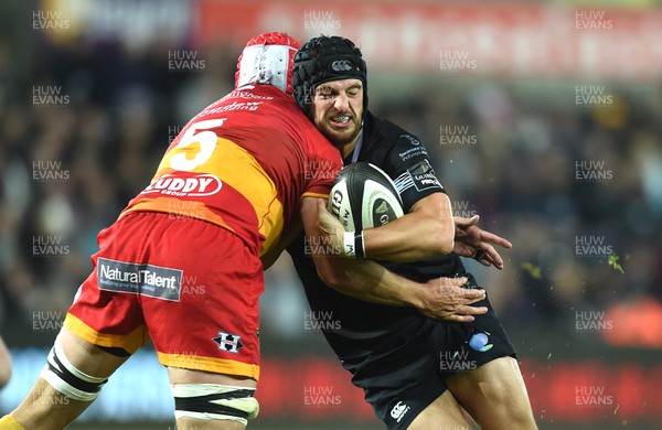 271017 - Ospreys v Dragons Rugby - Guinness PRO14 - Dan Evans of Ospreys is tackled by Cory Hill of Dragons