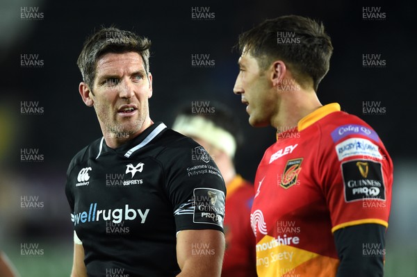 271017 - Ospreys v Dragons Rugby - Guinness PRO14 - James Hook of Ospreys and Gavin Henson of Dragons at the end of the game
