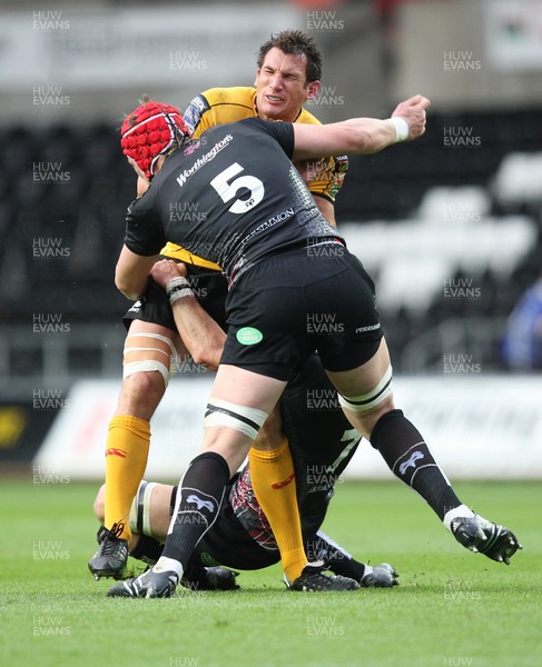 30.04.09 - Ospreys v Newport Gwent Dragons, Magners League -  Dragons' Joe Bearman is tackled by Ospreys' Marty Holah and Alun Wyn Jones   