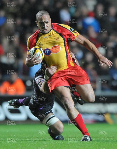 30.10.10 - Ospreys v Newport-Gwent Dragons - Magners League - Gavin Thomas of Newport-Gwent Dragons is tackled by Marty Holah of Ospreys. 