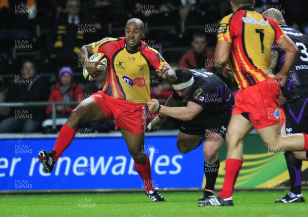 30.10.10 Ospreys v Newport Gwent Dragons - Magners League -  Dragons' Nathan Brew is caught by Ospreys' Ryan Bevington. 